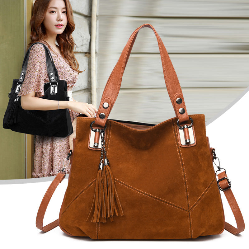 Bolso bandolera de ante con cremallera y borlas retro para mujer
