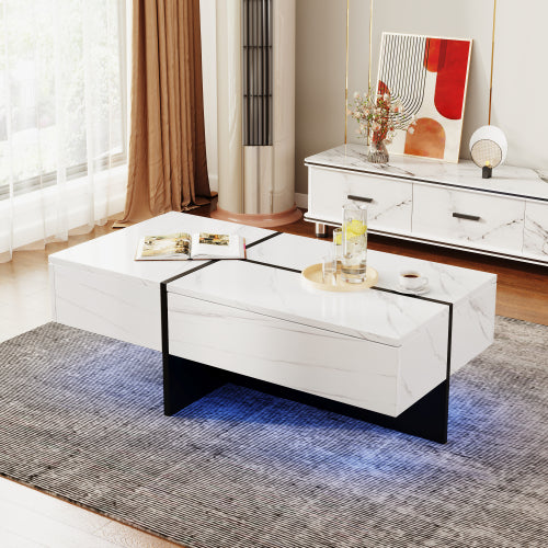 Mesa de centro de alto brillo, estructura efecto mármol blanco con elevadores negros a juego, mueble de salón con sistema de iluminación LED controlado por app.