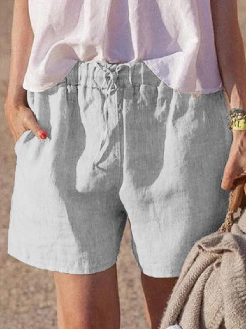 Pantalones casuales holgados de algodón y lino de color liso con cintura elástica y cordón para atar.