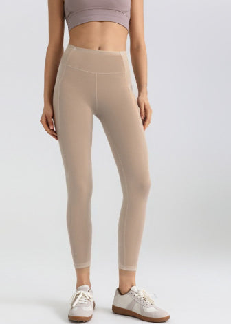 Leggings deportivos elásticos de malla con bolsillos laterales