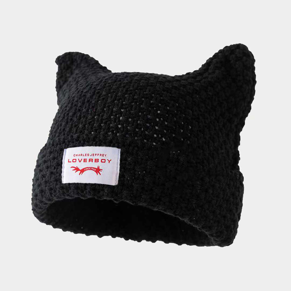 Gorro de punto a rayas hecho a mano con lindas orejas de gato, informal y cálido.