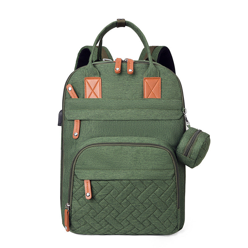 Bolsa multifuncional para cochecito con carga USB y compartimentos separados para ropa seca y húmeda.