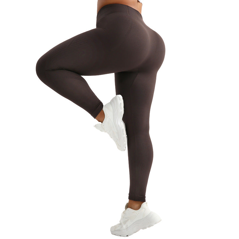 Pantalones de yoga de cintura alta que realzan los glúteos, con absorción de humedad y alta elasticidad.
