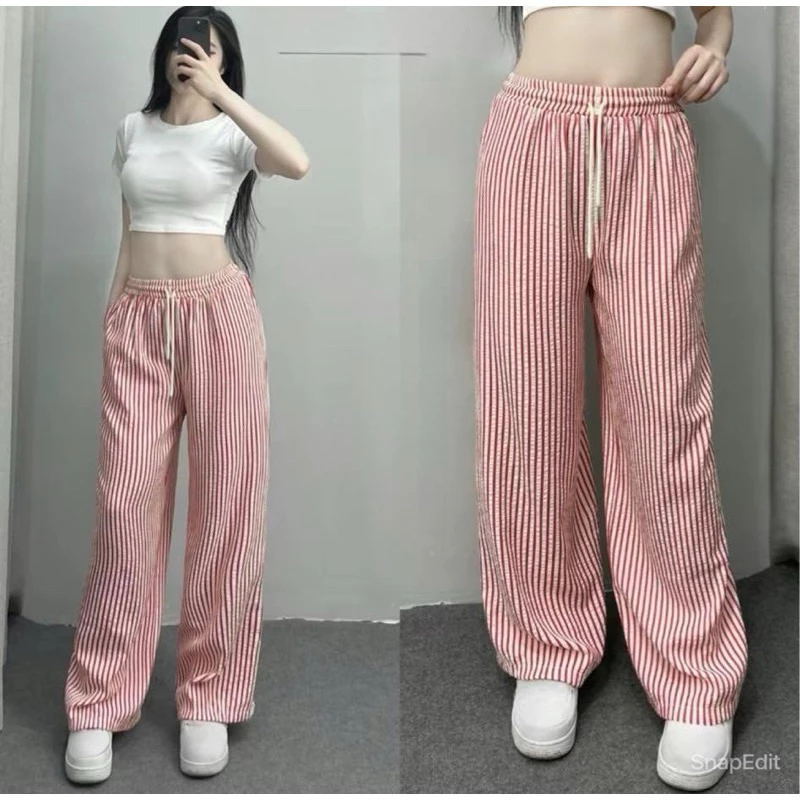 Pantalones anchos de rayas verticales en blanco y negro para mujer