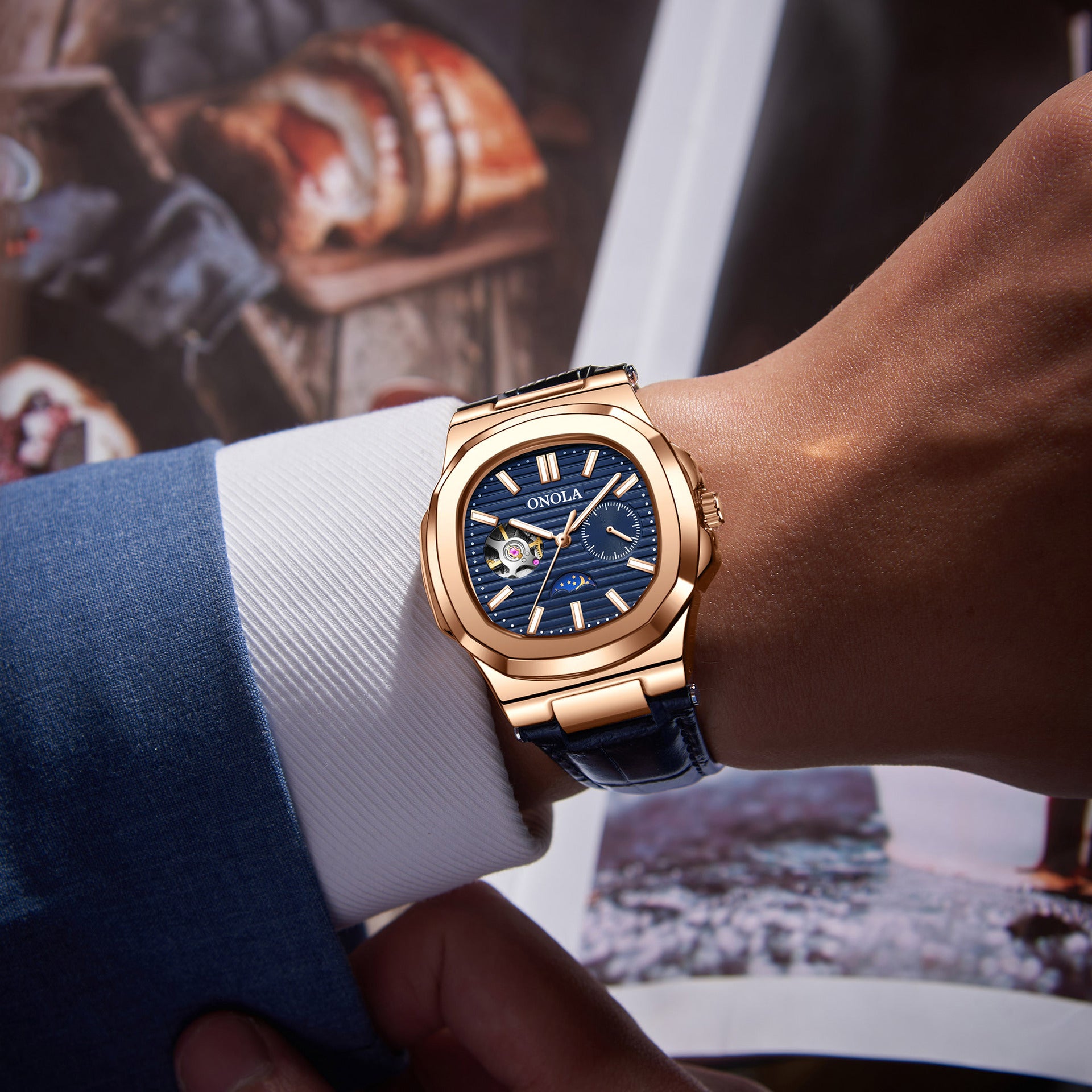 Reloj mecánico de alta calidad con diseño de sol, luna y estrellas, correa de cuero impermeable.