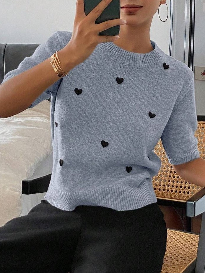 Suéter de punto jacquard con cuello redondo y corazón para mujer