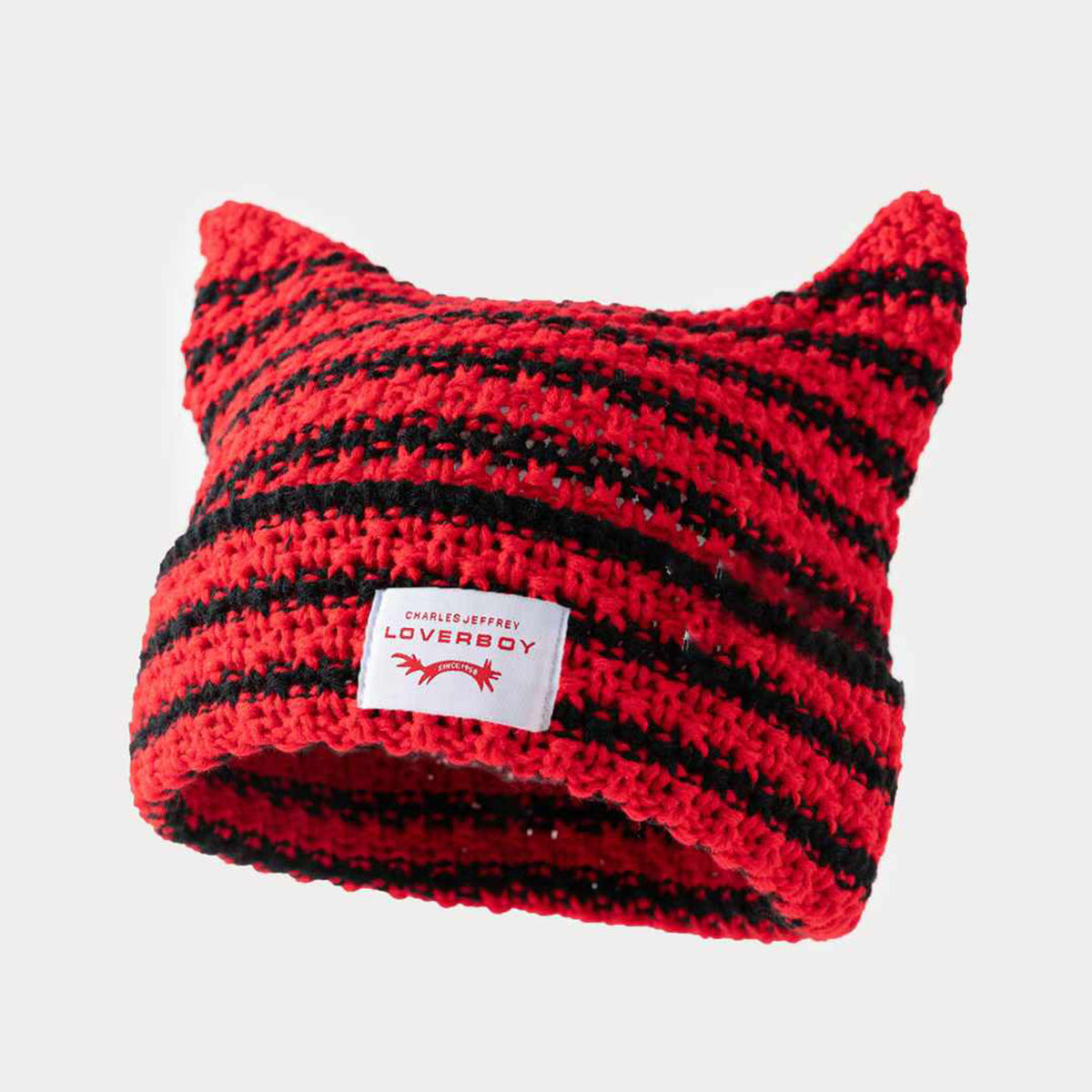 Gorro de punto a rayas hecho a mano con lindas orejas de gato, informal y cálido.