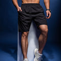Pantalones cortos deportivos y de fitness informales, holgados, de secado rápido y transpirables para hombre