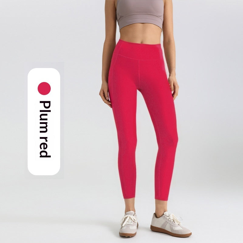 Leggings deportivos elásticos de malla con bolsillos laterales