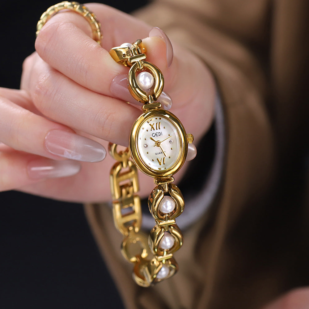 Reloj de pulsera Gedi de estilo nacional con esmeralda, atractivo, de nicho, de alta calidad, ligero, de lujo, con perlas de concha, exquisito reloj de cuarzo para mujer.