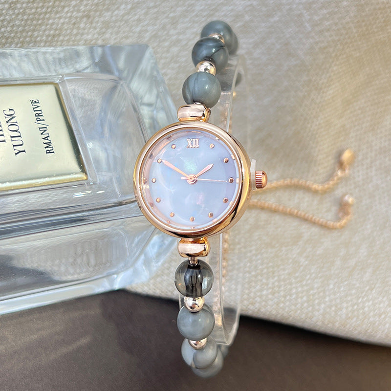 Reloj de cuarzo para mujer con pulsera de perlas, diseño lujoso y ligero, esfera pequeña y correa ajustable extraíble.