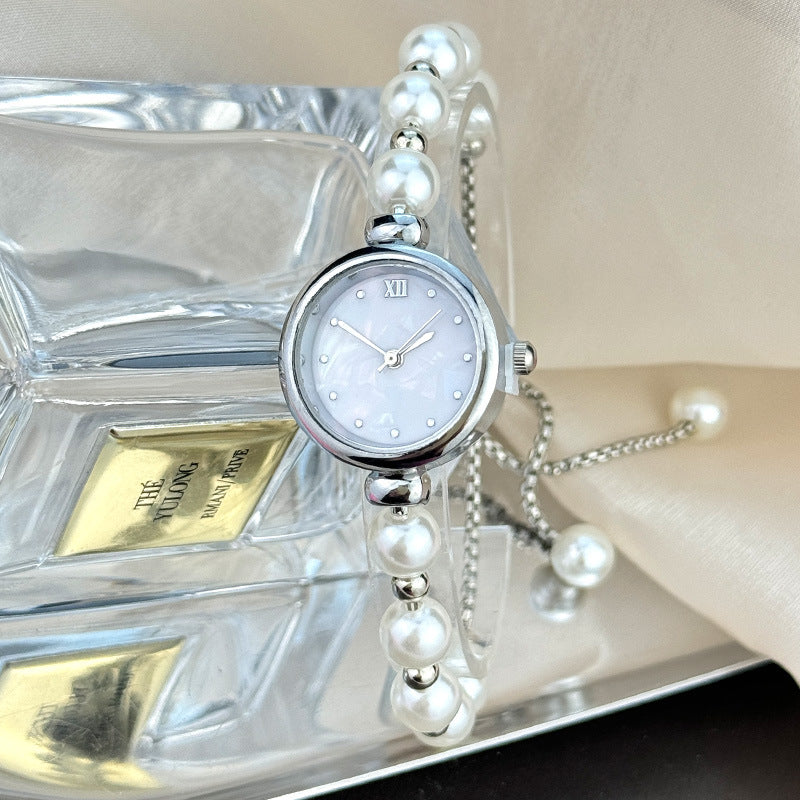 Reloj de cuarzo para mujer con pulsera de perlas, diseño lujoso y ligero, esfera pequeña y correa ajustable extraíble.