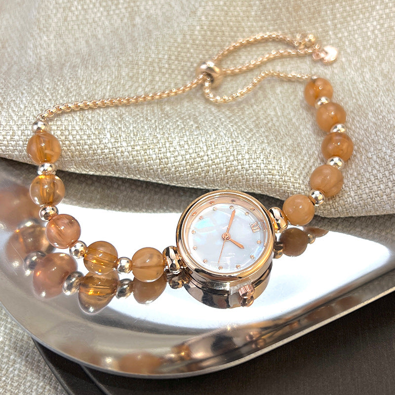 Reloj de cuarzo para mujer con pulsera de perlas, diseño lujoso y ligero, esfera pequeña y correa ajustable extraíble.