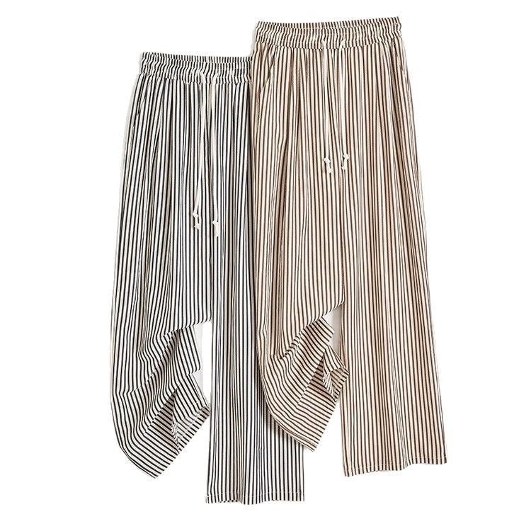 Pantalones anchos de rayas verticales en blanco y negro para mujer