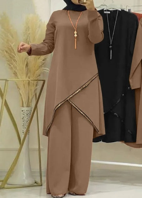 Traje informal de mujer con camisa de manga larga y cuello redondo y pantalones de pierna ancha