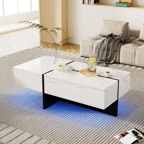 Mesa de centro de alto brillo, estructura efecto mármol blanco con elevadores negros a juego, mueble de salón con sistema de iluminación LED controlado por app.