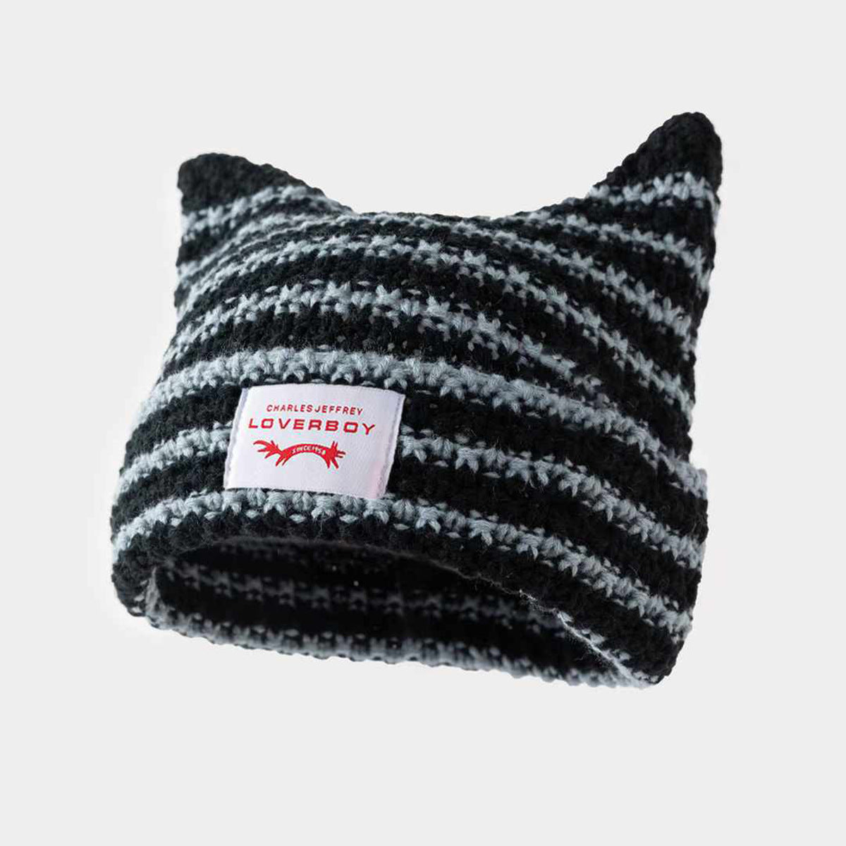 Gorro de punto a rayas hecho a mano con lindas orejas de gato, informal y cálido.