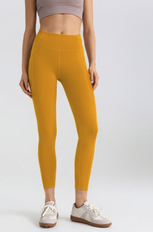 Leggings deportivos elásticos de malla con bolsillos laterales