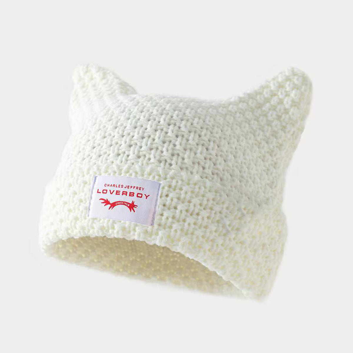 Gorro de punto a rayas hecho a mano con lindas orejas de gato, informal y cálido.
