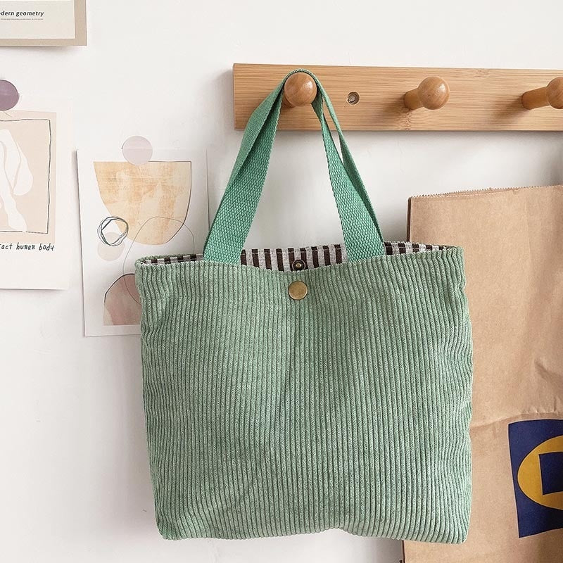 Bolso de lona minimalista de hilo grueso con estampados a doble cara. Un bolso de lona versátil y de gran capacidad para mujer.