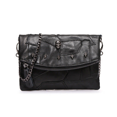 Bolso bandolera con cadena y diseño de patchwork en bloques de color