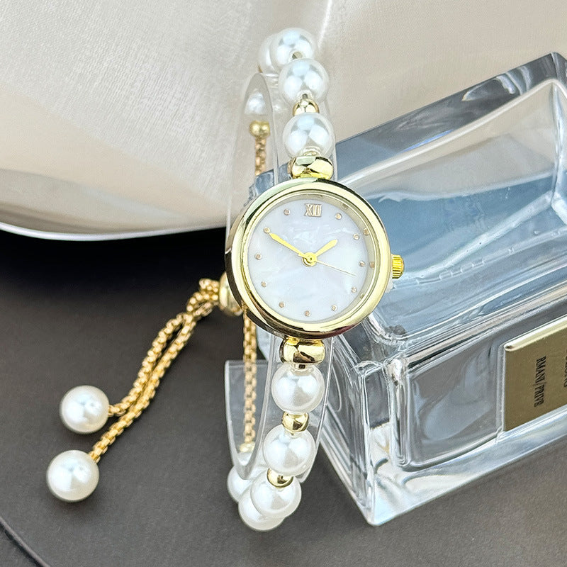 Reloj de cuarzo para mujer con pulsera de perlas, diseño lujoso y ligero, esfera pequeña y correa ajustable extraíble.