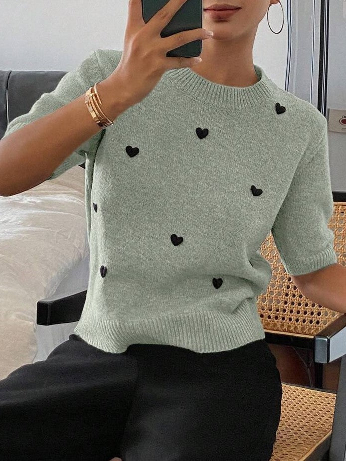 Suéter de punto jacquard con cuello redondo y corazón para mujer