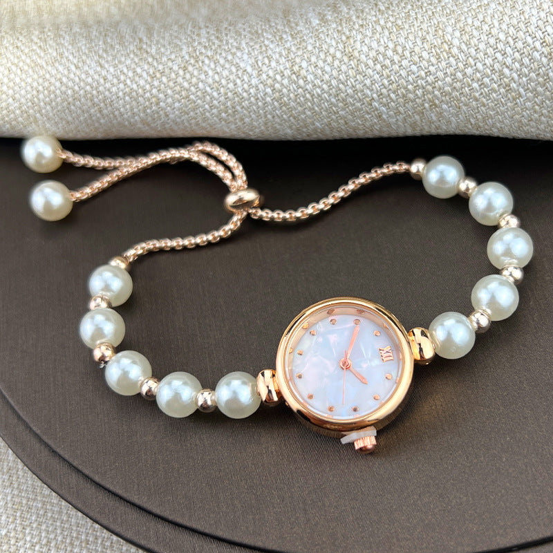 Reloj de cuarzo para mujer con pulsera de perlas, diseño lujoso y ligero, esfera pequeña y correa ajustable extraíble.