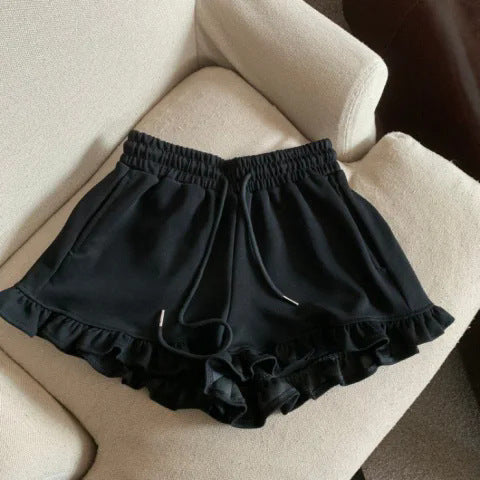 Shorts deportivos casuales de diseño con volantes y bordes desenfadados, de estilo nicho.