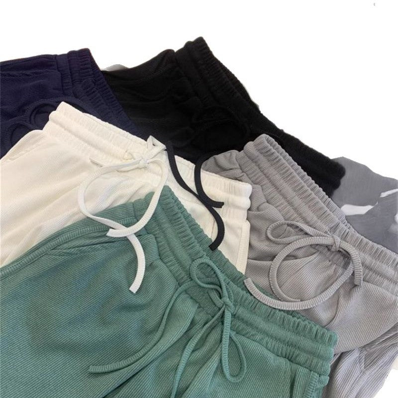 Pantalones de yoga para mujer, versátiles, de pierna ancha y con múltiples combinaciones, en colores lisos.