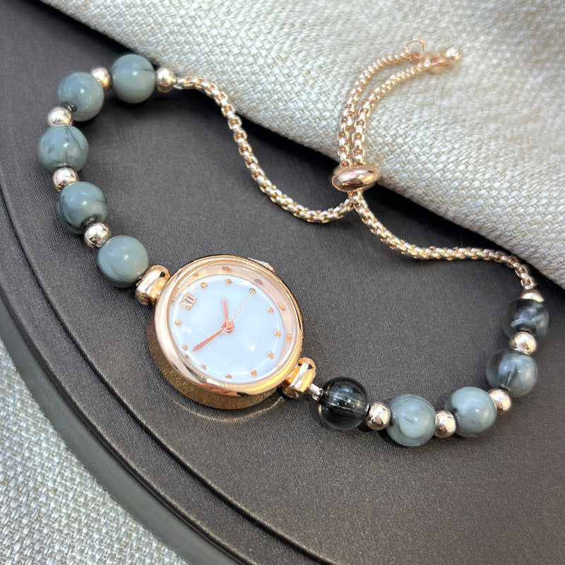 Reloj de cuarzo para mujer con pulsera de perlas, diseño lujoso y ligero, esfera pequeña y correa ajustable extraíble.