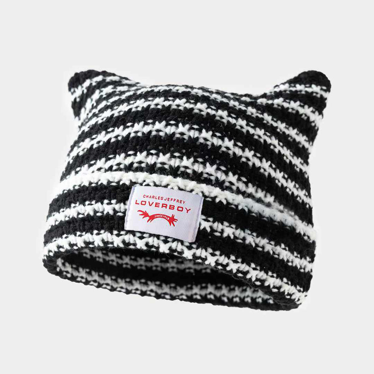 Gorro de punto a rayas hecho a mano con lindas orejas de gato, informal y cálido.