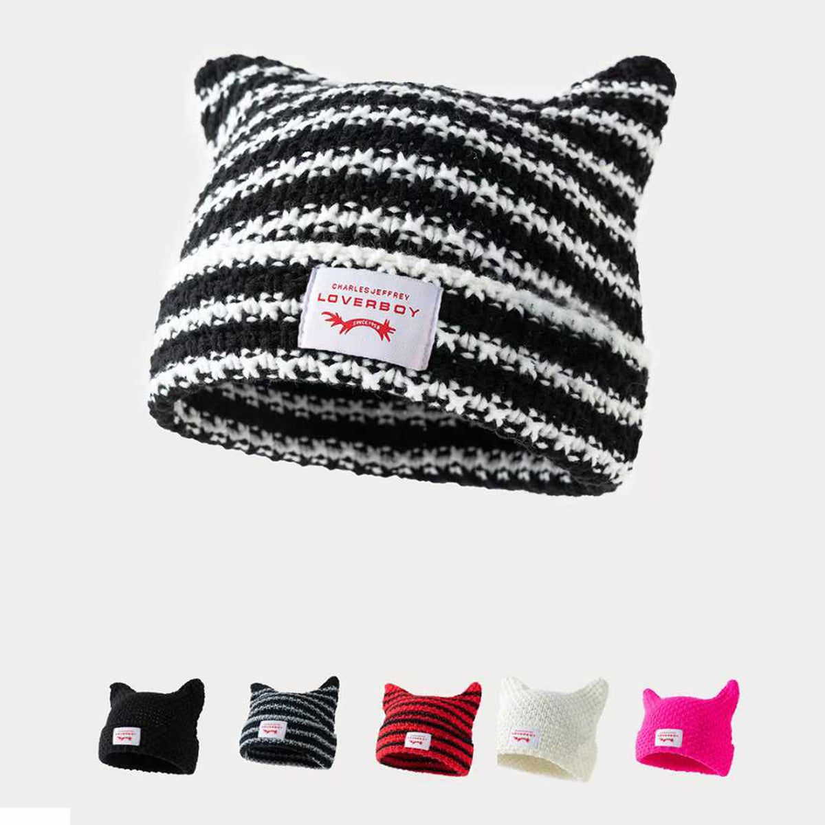 Gorro de punto a rayas hecho a mano con lindas orejas de gato, informal y cálido.