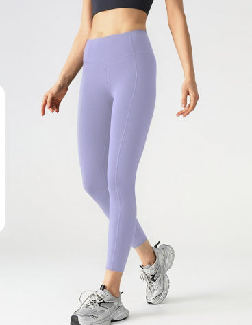 Leggings deportivos elásticos de malla con bolsillos laterales