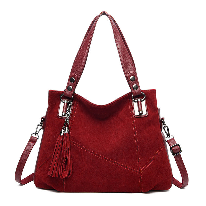 Bolso bandolera de ante con cremallera y borlas retro para mujer