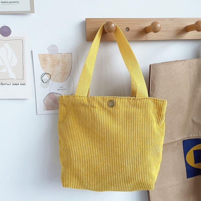 Bolso de lona minimalista de hilo grueso con estampados a doble cara. Un bolso de lona versátil y de gran capacidad para mujer.