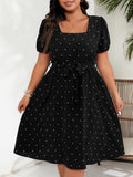 Elegante vestido retro de lunares con cintura ceñida para mujer