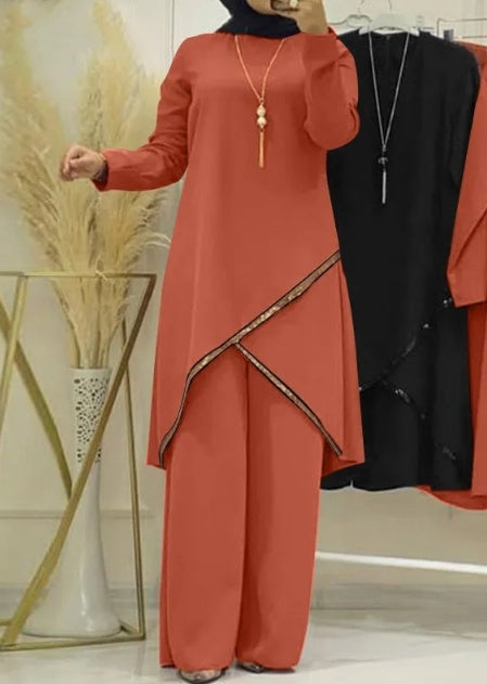Traje informal de mujer con camisa de manga larga y cuello redondo y pantalones de pierna ancha