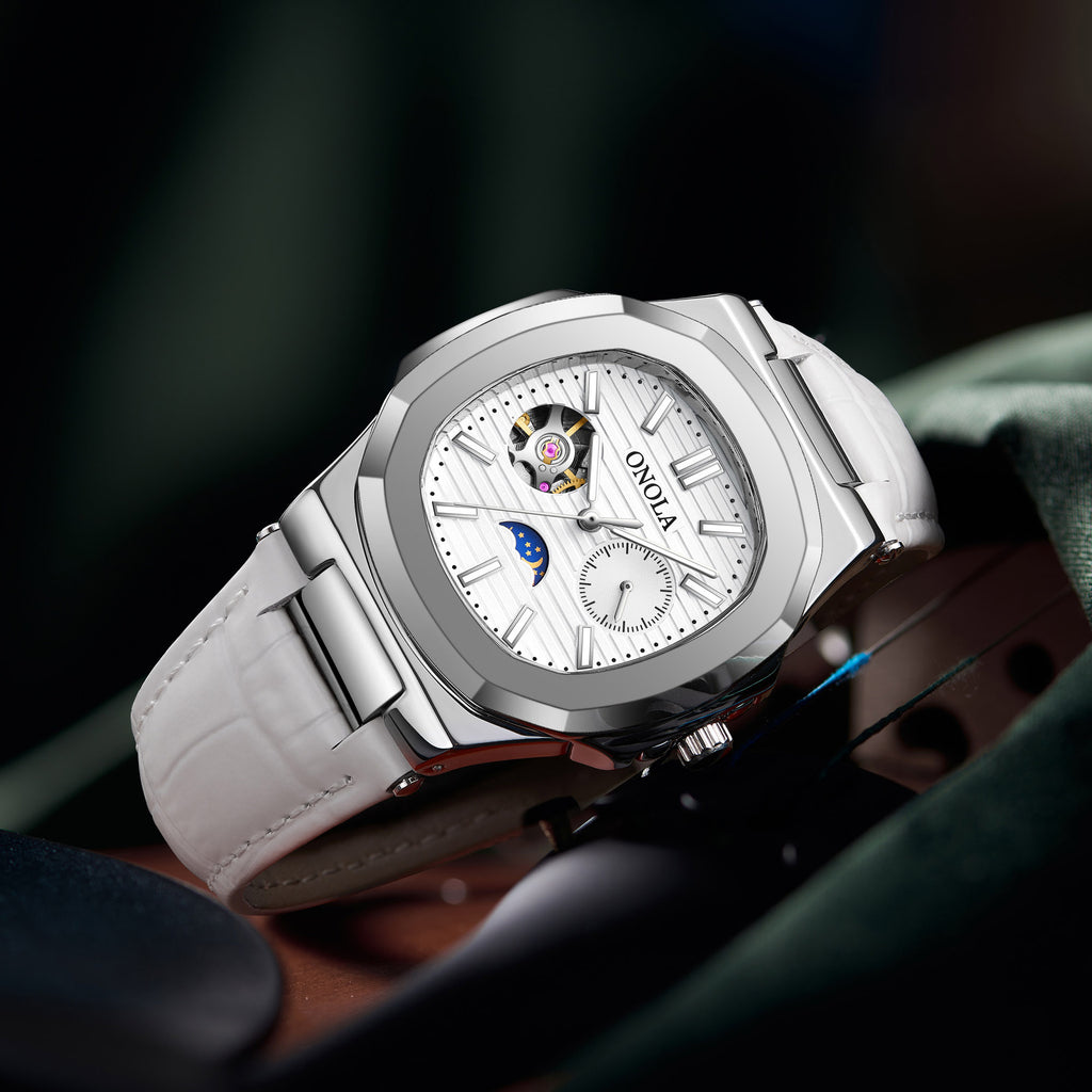 Reloj mecánico de alta calidad con diseño de sol, luna y estrellas, correa de cuero impermeable.