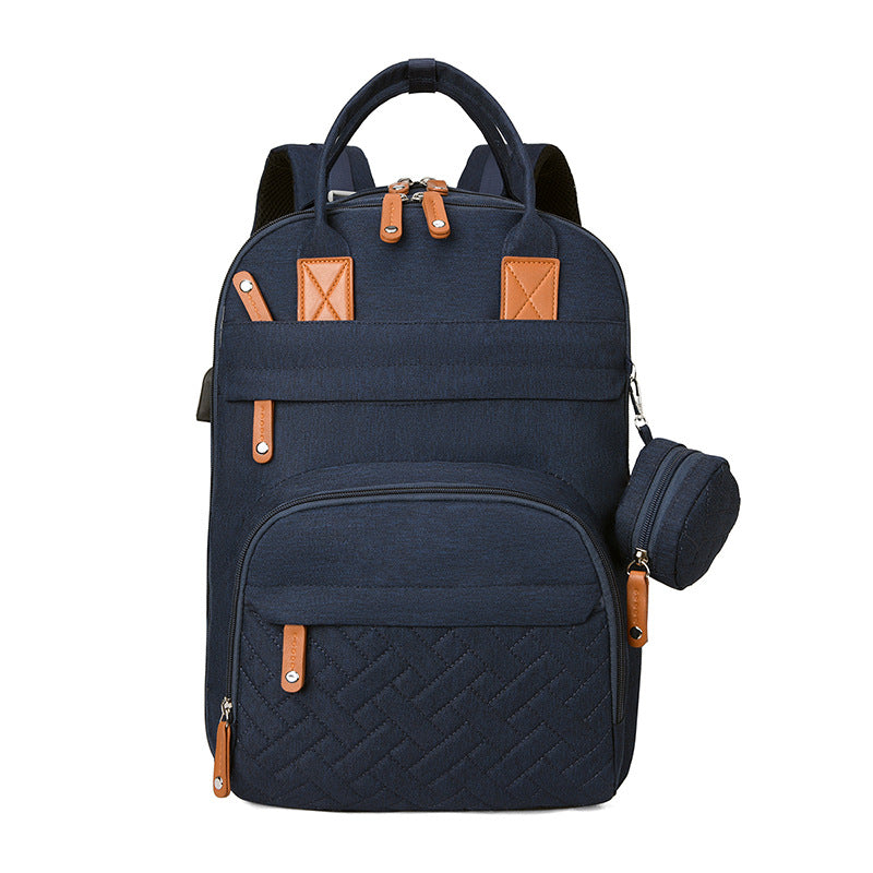 Bolsa multifuncional para cochecito con carga USB y compartimentos separados para ropa seca y húmeda.