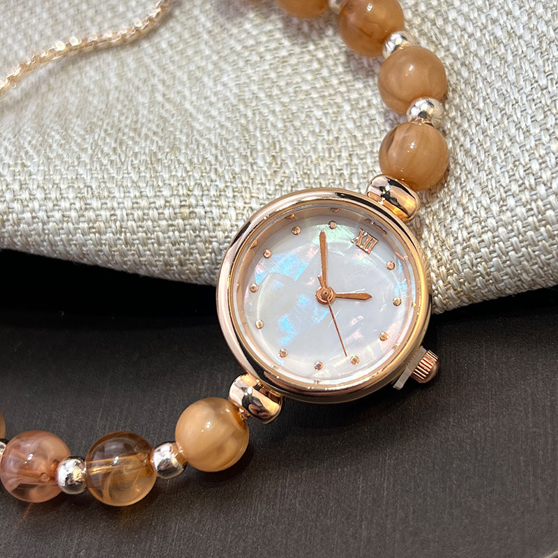 Reloj de cuarzo para mujer con pulsera de perlas, diseño lujoso y ligero, esfera pequeña y correa ajustable extraíble.
